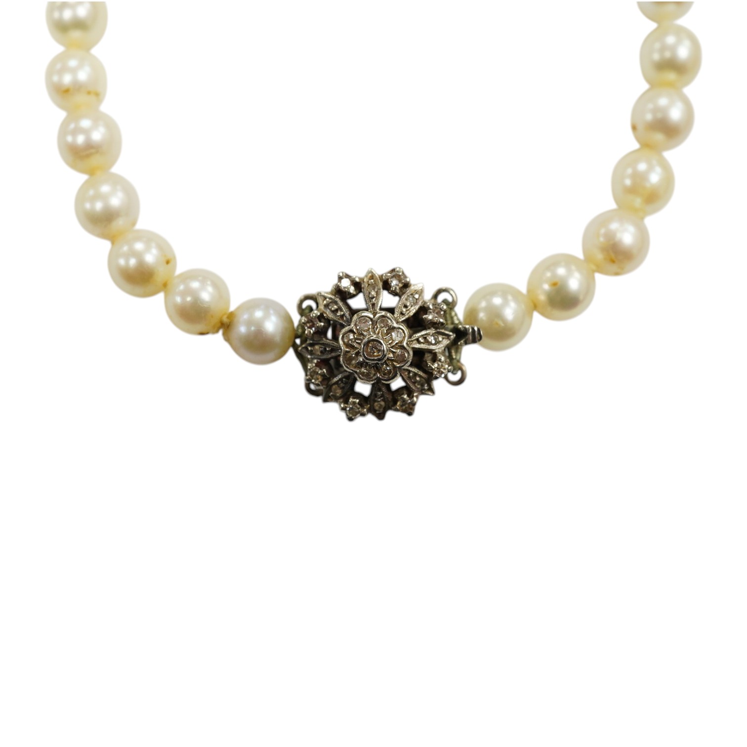 A single strand cultured pearl necklace, with diamond chip set white metal clasp, 88cm. Condition - fair to good